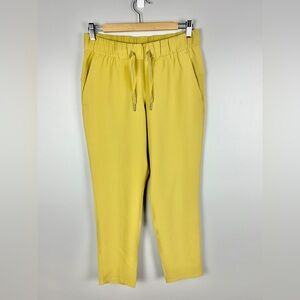 LULULEMON On The Fly Pant 27" Size 6 Mustard Yellow Relaxed Athleisure Gym